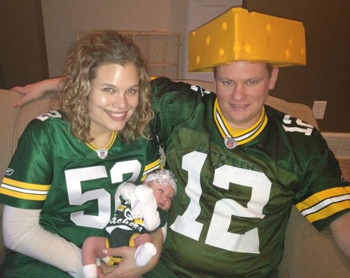 me, my cheesehead husband, and our little baby God-daughter
